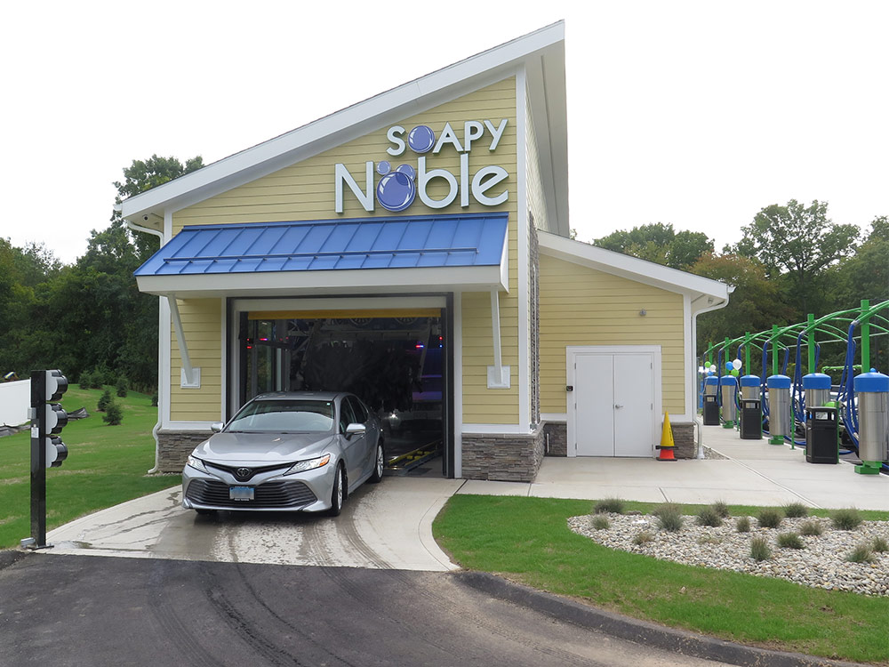 Soapy Noble Car Wash Exterior with Car Exiting
