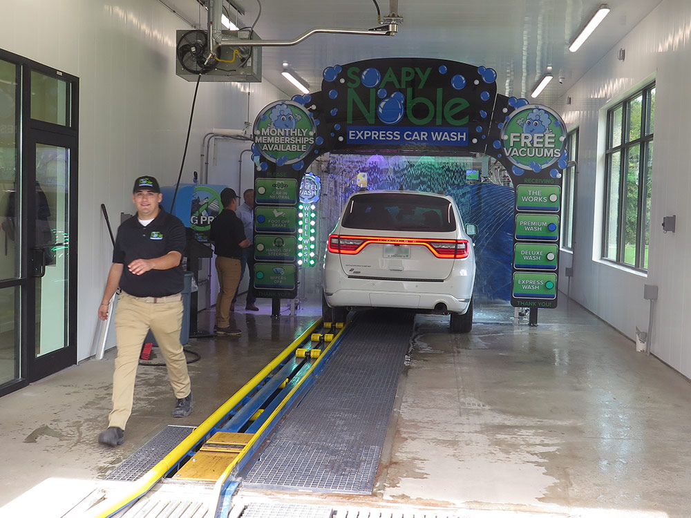 Soapy Noble Car Wash Interior with Employees